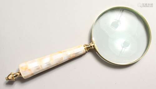 A MAGNIFYING GLASS with mother of pearl handle.