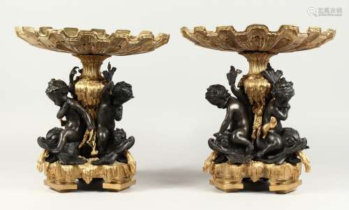 A GOOD PAIR OF BRONZE AND GILT BRONZE COMPORTS with shell sh...
