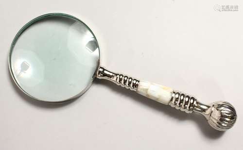 A MAGNIFYING GLASS with mother of pearl and chrome handle.