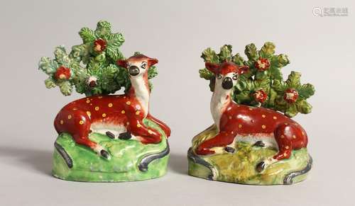 A PAIR OF STAFFORDSHIRE BOCAGE GROUPS OF RED DEER with yello...