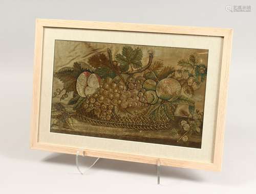 A FRAMED AND GLAZED NEEDLEWORK PICTURE OF FRUIT, in a basket...