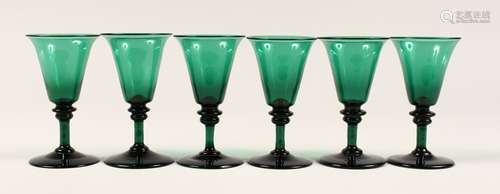 A SET OF SIX GREEN GLASSES 5ins high