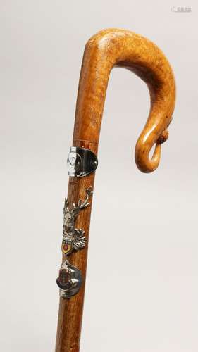 A SCOTTISH WALKING STICK with thistle handle and mounted wit...