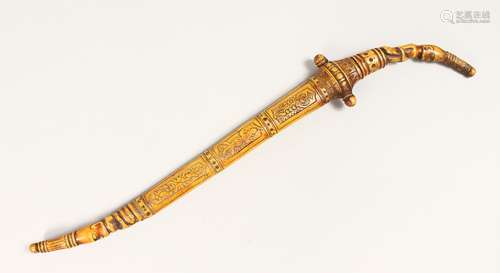 AN ISLAMIC DAGGER with silver inlaid blade.