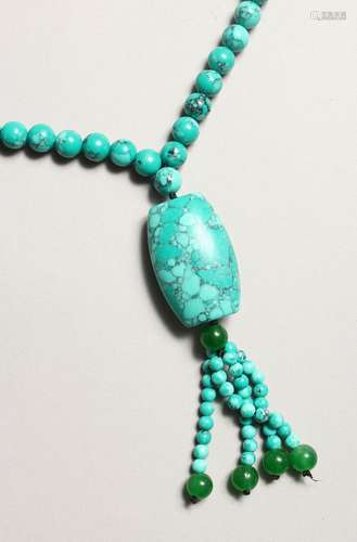 A TURQUOISE BEAD NECKLACE.