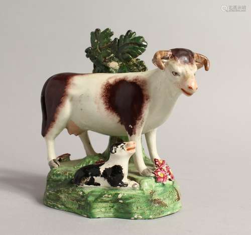 A PAIR OF STAFFORDSHIRE BOCAGE GROUPS OF A COW AND CALF 5.5i...