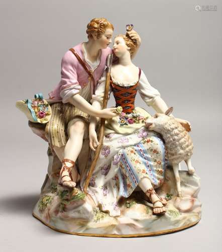 A SUPERB 19TH CENTURY MEISSEN FIGURE OF LOVERS seated on a r...