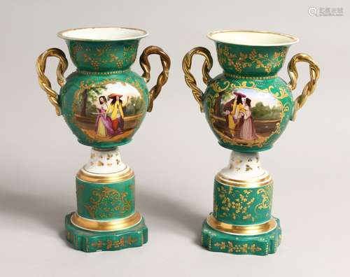 A PAIR OF 19TH CENTURY PARIS GREEN GROUP TWO HANDLED URNS wi...