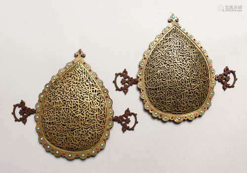 A PAIR OF 19TH CENTURY ISLAMIC GILT METAL OPENWORK CALLIGRAP...