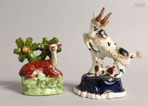 A SMALL STAFFORDSHIRE BOCAGE GROUP OF A DEER with spots and ...