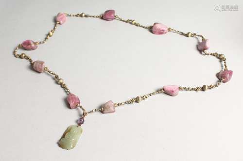 A 19TH CENTURY CHINESE QING DYNASTY CARVED JADE PENDANT NECK...