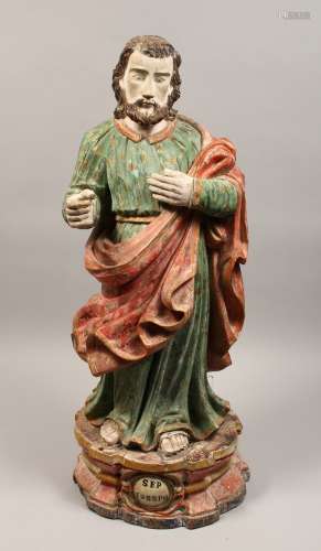 A 17TH - 18TH CENTURY CARVED WOOD FIGURE OF JOSEPH 29ins hig...