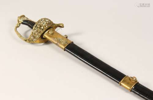 A GOOD NAVAL OFFICERS SWORD in a leather scabbard 3ft 1ins l...