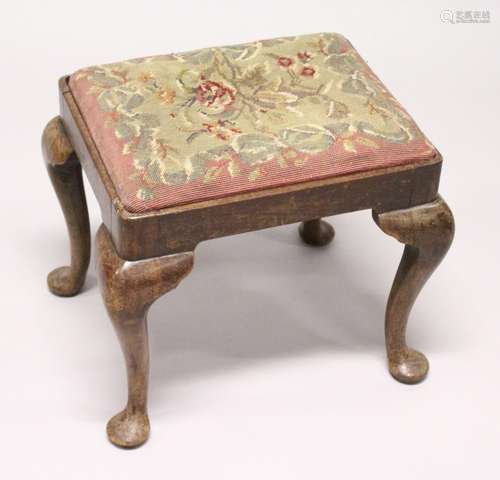 A GEORGIAN STOOL with needlework top on cabriole legs 1ft 7i...