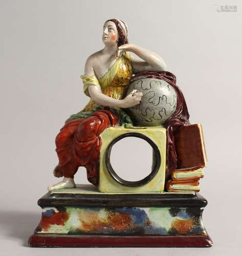 A PRATTWARE CLOCK CASE, a classical female seated beside a g...