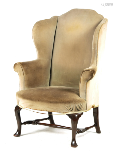 A GEORGE II MAHOGANY WINGBACK UPHOLSTERED ARMCHAIR