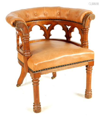 A 19TH CENTURY OAK GOTHIC STYLE UPHOLSTERED LEATHER