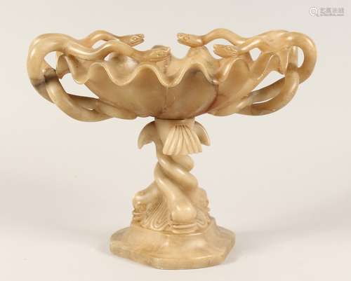 A 19TH CENTURY CARVED ALABASTER TAZZA with serpent handles a...