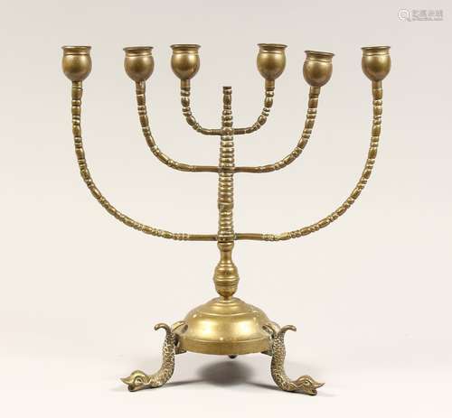 AN ANTIQUE JEWISH BRASS MENORAH 13ins high