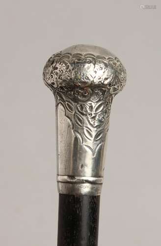 A WALKING CANE with silver handle Birmingham 1914 33ins long