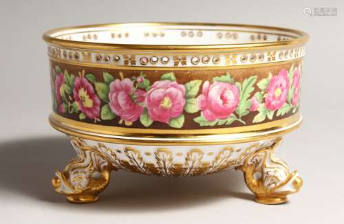 A GOOD CIRCULAR BOWL painted with a band of roses, on three ...