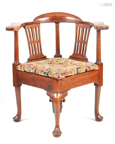 A GEORGE II MAHOGANY CORNER CHAIR with shaped armrest