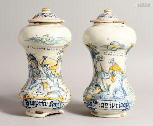 A PAIR OF ITALIAN MAJOLICA SPICE JARS AND COVERS painted wit...