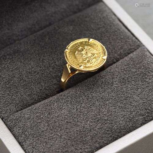 Bague en or jaune 18K 750 millièmes ornée d'une pièce de Dos...