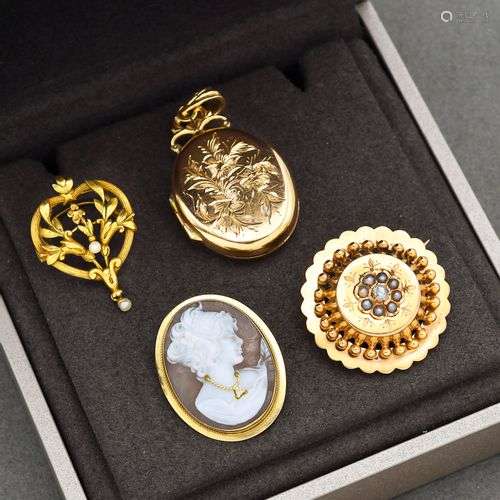 Lot en or jaune 18K 750 millièmes formé de deux broches rond...