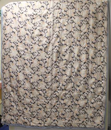 Early 20th century quilted bedspread with pale floral decora...