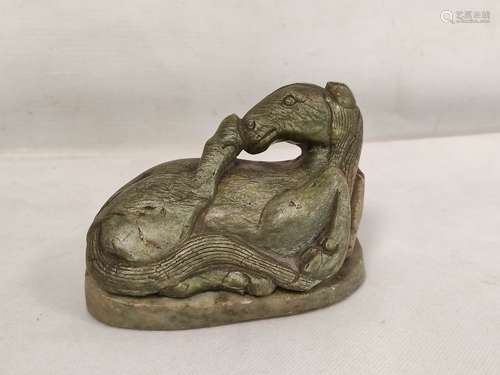 Chinese Tang style carved green soapstone figure of a recumb...