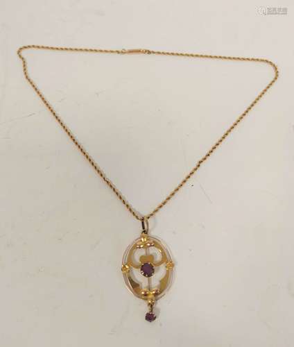 Gold oval pendant of Art Nouveau style with amethyst on gold...