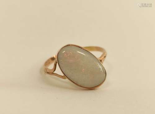 Opal ring with split shank mount, set at an angle.