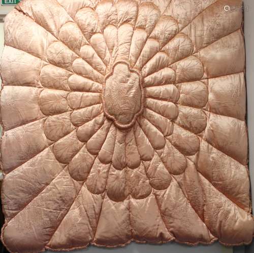 Early 20th century eiderdown of peach satin quilted and embr...
