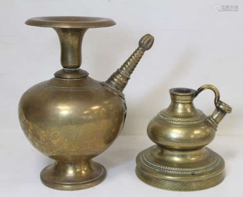 Two Eastern brass hookah bases, one of baluster form with fl...