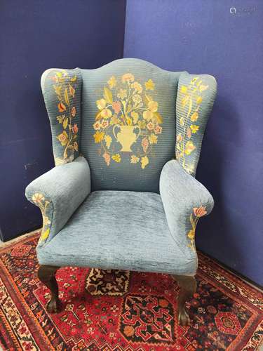 Chippendale style wing armchair upholstered in floral needle...