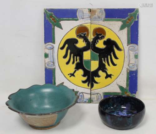 Pair of Continental faience pottery tiles forming a crest wi...