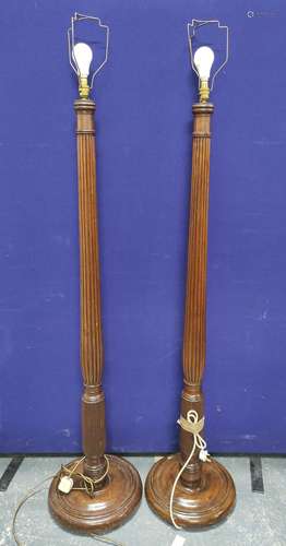 Pair of reeded column mahogany standard lamps on turned base...