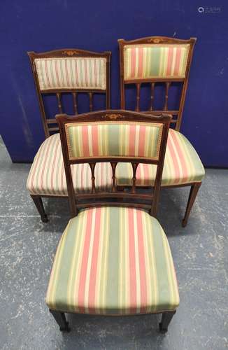 Pair of Edwardian inlaid salon chairs raised on square taper...