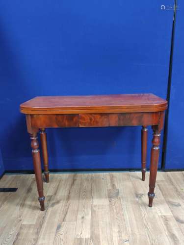 Mahogany folding card table, the swivel top raised on turned...