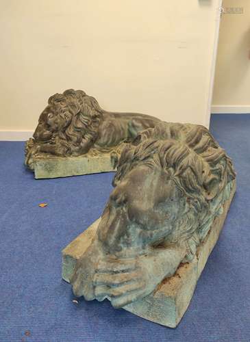 Fine large pair of cast bronze lions, recumbent on rectangul...