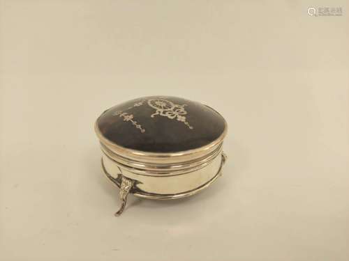 Silver inlaid tortoiseshell circular trinket box on shaped f...