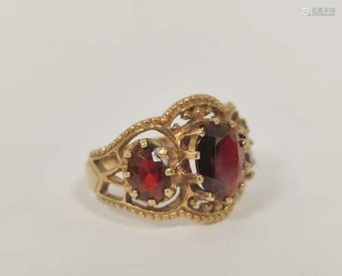 Garnet three stone ring in 9ct gold. Size 'O'.