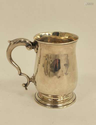 Silver baluster mug with leaf capped scroll handle, initiall...