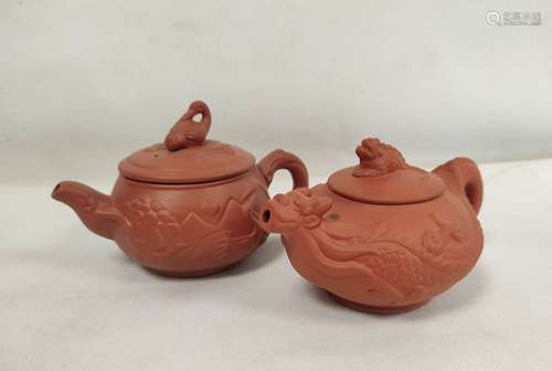 Two Chinese Yixing teapots, one decorated with moulded bird ...