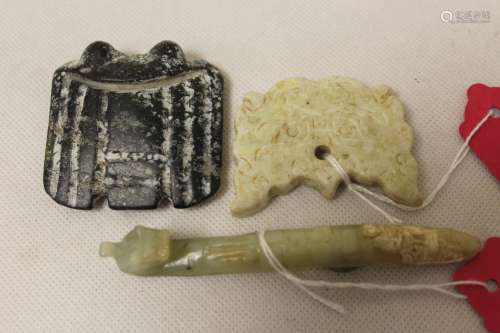 Three Chinese archaic and archaised jade carvings to include...