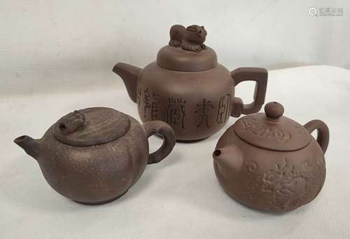 Three Chinese Yixing clay teapots one of cylindrical form wi...