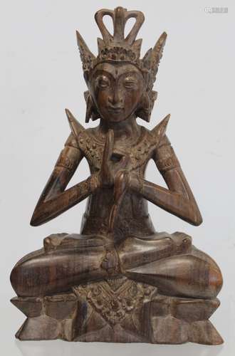 Eastern carved hardwood figure of a Buddha seated on a trian...