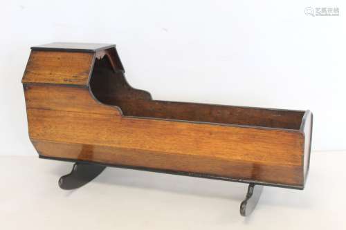 19th century mahogany doll's cradle with shaped hood on two ...