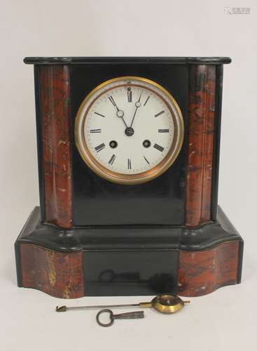 French rouge and black marble mantel clock with shaped mould...